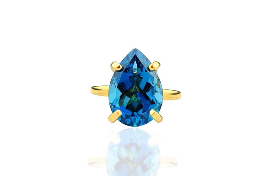 Pierścionek ze złota z naturalnym topazem London Blue 6 ct o szlifie kropli, biżuteria Brazi.
