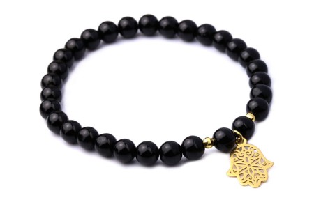 Bransoletka z naturalnym turmalinem i zawieszką w kształcie dłoni Fatimy, symbolizująca ochronę i szczęście. Elegancka ozdoba, idealna na każdą okazję. Perfekcyjny dodatek do codziennych stylizacji.