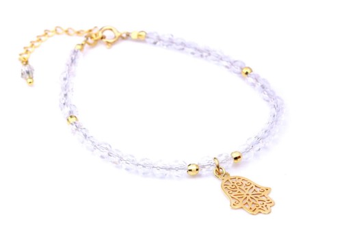 Elegancka bransoletka z kryształem górskim i zawieszką Hamsa, idealna do podkreślenia Twojego stylu. Wykonana z dbałością o detale, przyciąga uwagę i dodaje uroku każdej stylizacji.