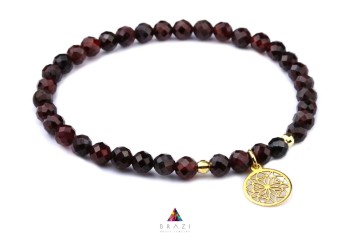 Bransoletka z naturalnych fasetowanych granatów ze złotymi elementami i zawieszką mandala, biżuteria Brazi