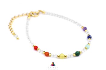 Bransoletka z fasetowanego kryształu górskiego i kolorowych kamieni ze złotym zapięciem, biżuteria Brazi