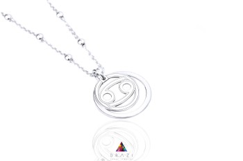 Srebrny naszyjnik z okrągłą zawieszką na dekoracyjnym łańcuszku z kuleczkami, biżuteria Brazi