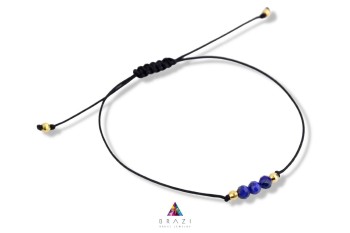 Bransoletka Szczęścia Brazi Druse Jewelry: subtelna, z Lapis Lazuli, na czarnym sznurku.