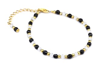 Bransoletka z kryształu górskiego i czarnego turmalinu z pozłacanymi przekładkami na białym tle, marka Brazi