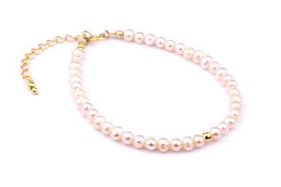 Bransoletka Włoskie Perły: Delikatna bransoletka z kremowymi perłami i złotym zapięciem.