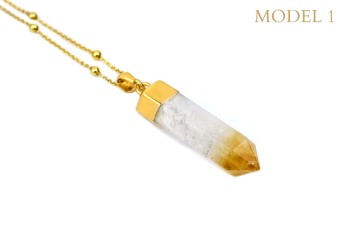 Naszyjnik z cytrynem w formie obelisku, złocona oprawa i jasny, niemal przezroczysty kamień z miodowym akcentem, biżuteria Brazi.