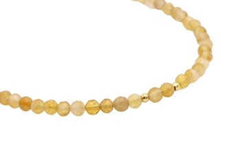 Naszyjnik z fasetowanym cytrynem i ozdobnymi złotymi kuleczkami, biżuteria Brazi